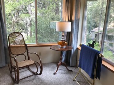 The Oak View room has a seating area with a vintage bent-wood rocker.