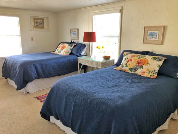 Guest bedroom with two full beds, sleeps 4.