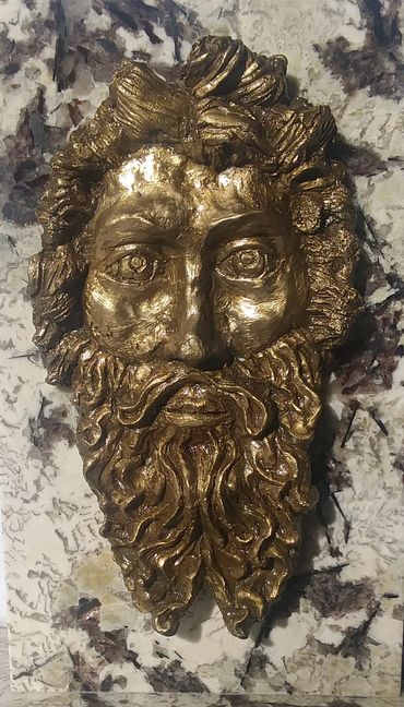 Face of God. Bronze on Granite 
by Mark P Costa