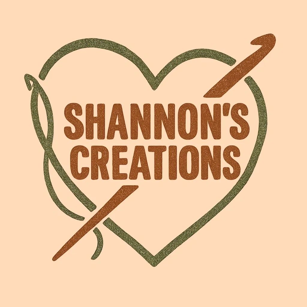 Logo for Shannon's Creations featuring a heart, a needle, and a crochet hook.