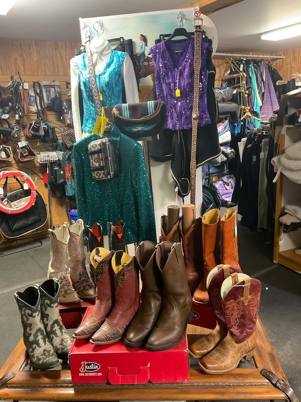 A new display featuring Western boots & fashion in our consignment area.