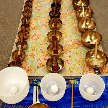 Quartz crystal and metal singing bowls ready to play in class