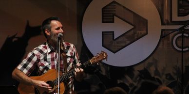 Worship leader playing guitar