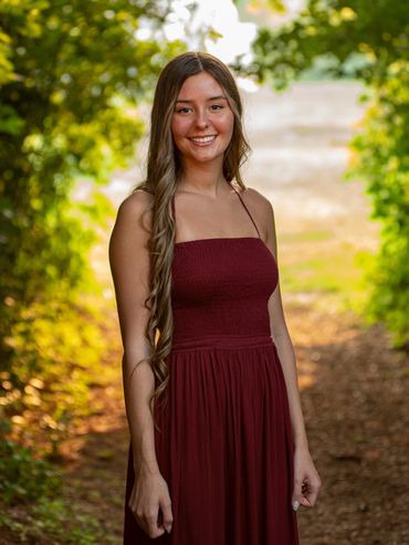 Girl with brown hair in a forest. Skylar | HUHS Senior | Class of 2026