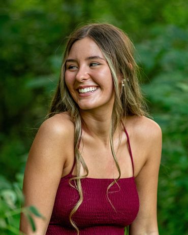 Girl with brown hair in a forest. Skylar | HUHS Senior | Class of 2026