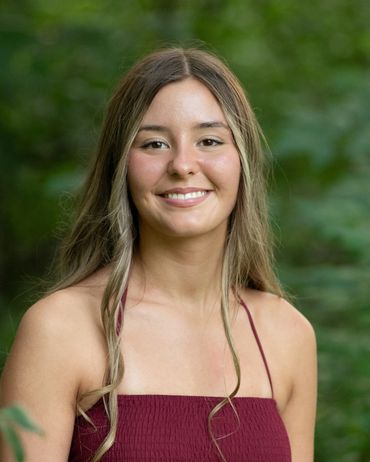 Girl with brown hair in a forest. Skylar | HUHS Senior | Class of 2026