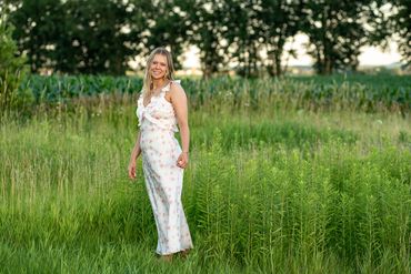 Girl with golden blonde hair among wildflowers Abby | HUHS Senior | Class of 2026