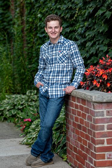 Brown-haired boy posing for pictures. Logan | HUHS Senior | Class of 2026