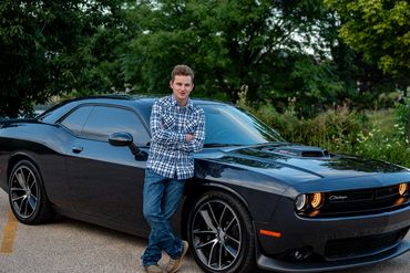 Brown-haired boy posing for pictures. Logan | HUHS Senior | Class of 2026