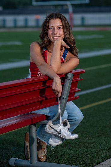 Brown-haired girl in track uniform. Lea | SHS Senior | Hurdles | Class of 2026