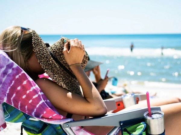 A woman having a great time by beach side in a beautiful property