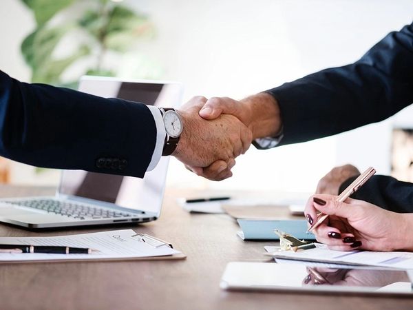 Two men shaking their hands