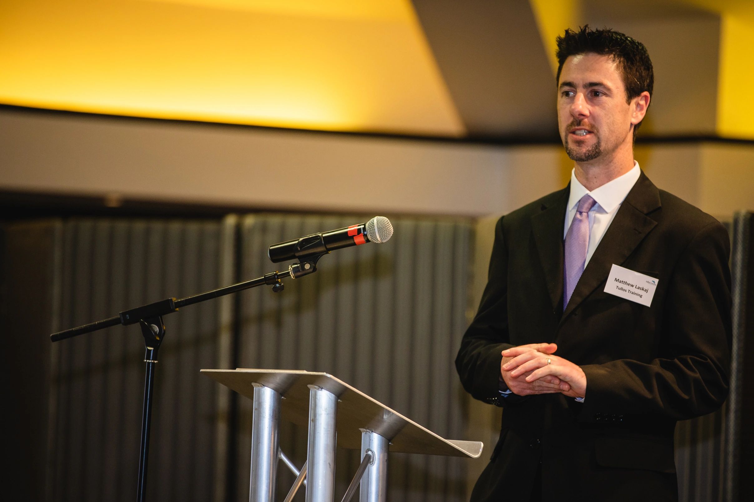 Matthew Laskaj presenting a speech