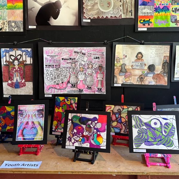 Colorful youth art exhibition showcasing diverse styles and themes.