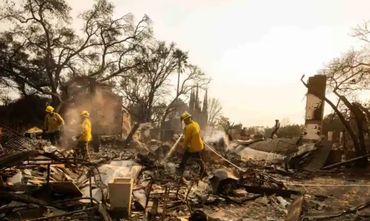 Workers in rubble and ash of Eaton Fire Altadena