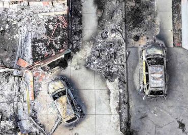 Burned out structure and cars at Eaton Fire location in Altadena
