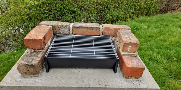 Brick BBQ at riverside glamping pod near Builth Wells, Powys – perfect for outdoor cooking