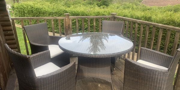 Outdoor seating on glamping pod deck – peaceful riverside setting near Builth Wells, Powys