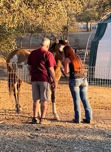 JJ with her Dad Joe, meeting Mr. Bones the horse he helped her rescue.