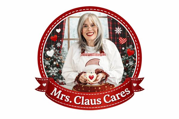Mrs. Claus holding a heart-themed mug with festive holiday decorations.