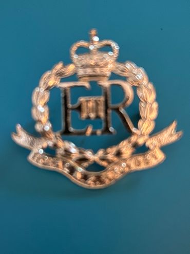 Royal Military Police (RMP) cap badge, featuring the Royal Cypher of Queen Elizabeth II, (ERII).