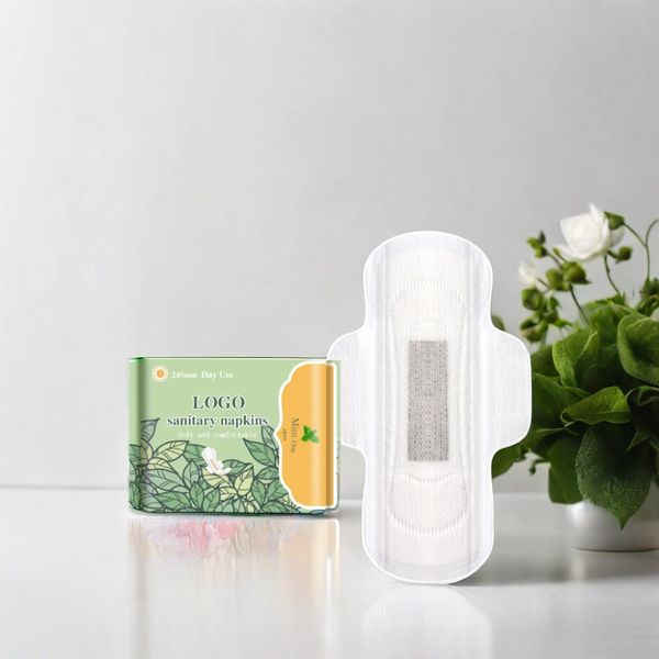 Sanitary napkins and packaging with floral design on a white surface.