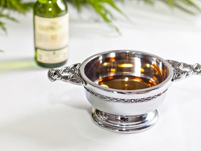 Traditional Scottish quaich filled with single malt whisky