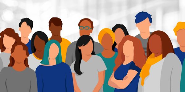 Diverse group of people standing together in a modern setting.