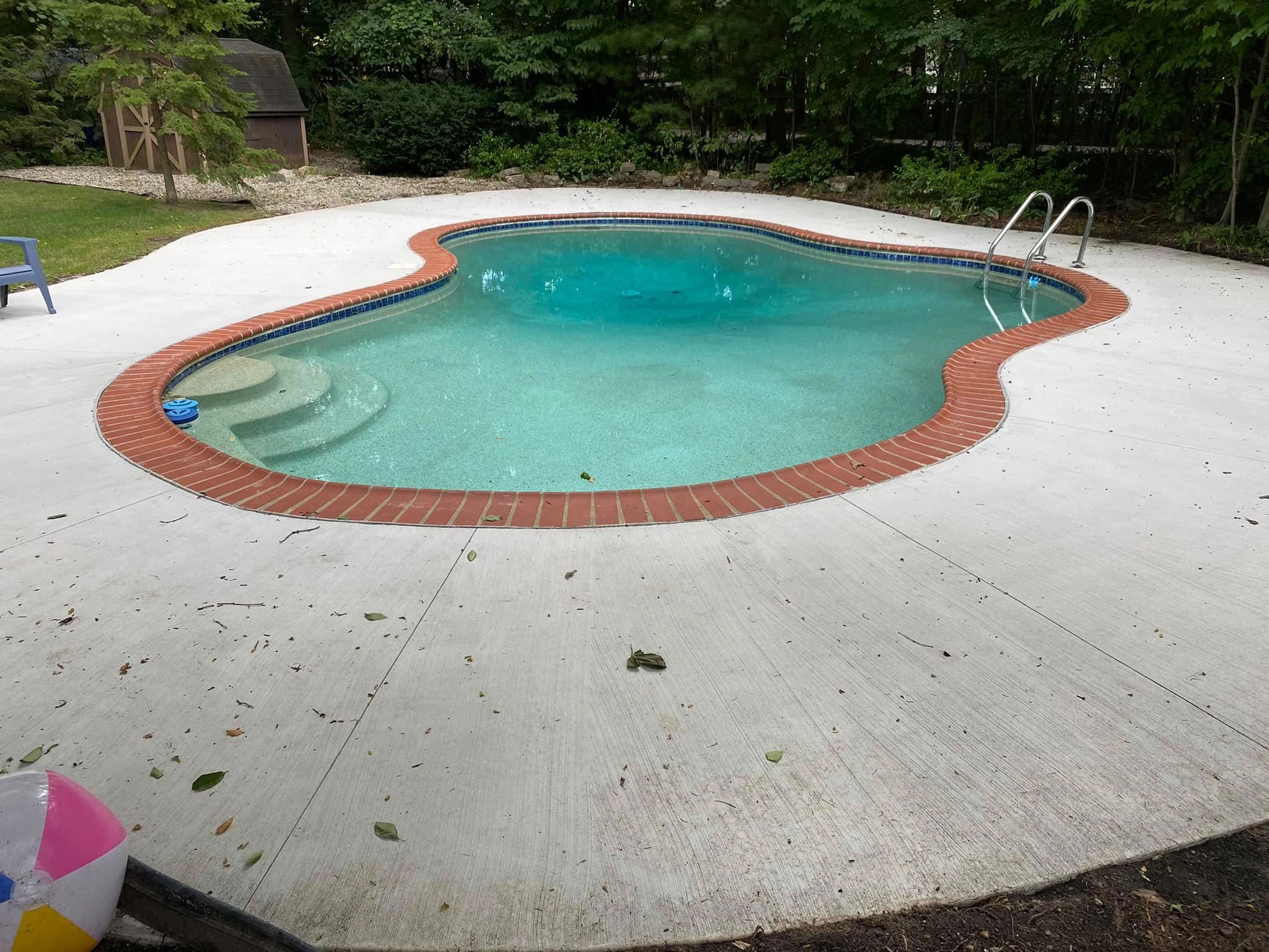 Pool deck installation in Shelby Township Michigan. Concrete pool deck company in Michigan. Cement