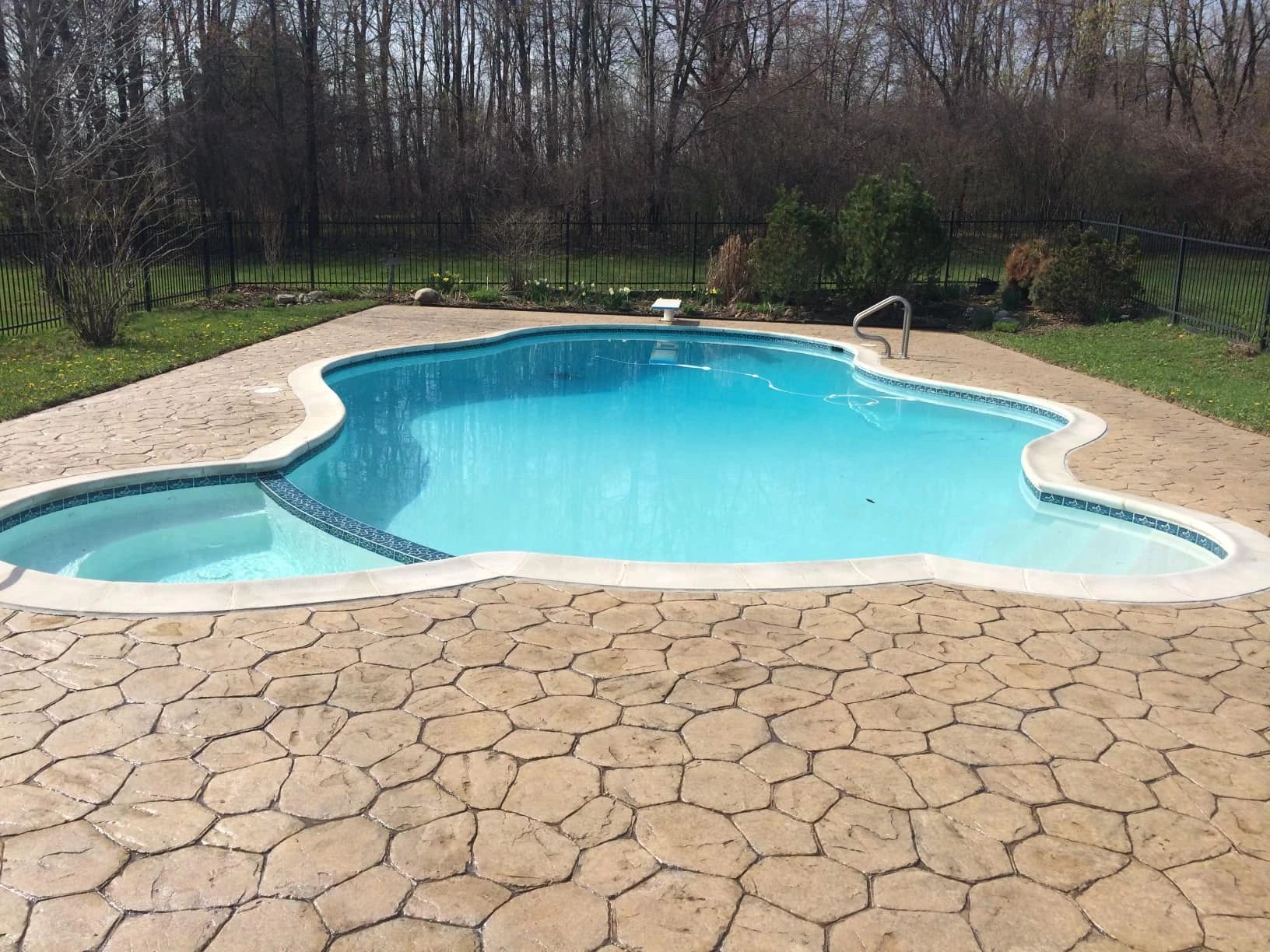Stamped concrete pool deck in macomb county Michigan, Oakland county Michigan pool installation