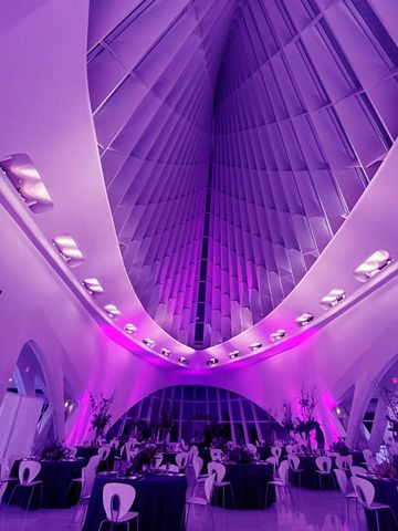 Milwaukee Art Museum lit up with Midwest DJ Productions uplighting for a wedding.