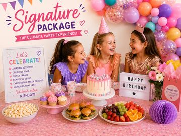 Three girls celebrating a birthday with cake and decorations.