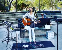 One woman loop band with acoustic guitars flutes and Brazilian percussion - conscious music