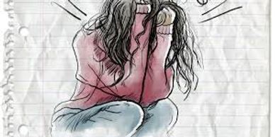 A distressed person holding their head, showing signs of anxiety or stress.
