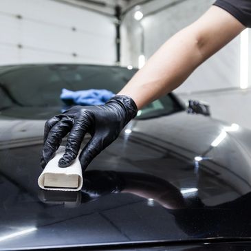 "High-gloss ceramic coating applied to a luxury car for long-lasting paint protection and shine"