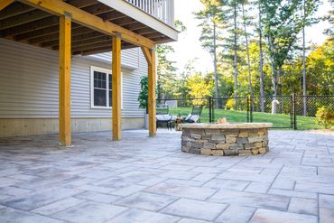 Techo-Bloc Blu pavers in Champlain Gray with custom stone veneer fire pit