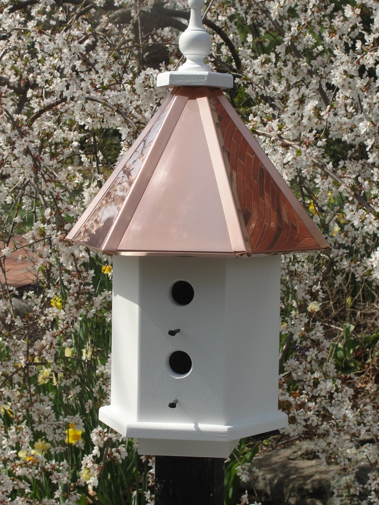 Post mounted Estate birdhouse with bright copper roof.  Four separate nesting compartments.