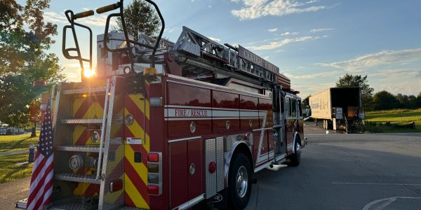 Fire rescue truck parked at sunset.