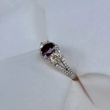 Side view of the finished red gemstone and diamond ring.