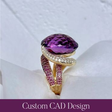 Side view of a finished custom gold ring with a large oval purple gemstone and pink and white accent