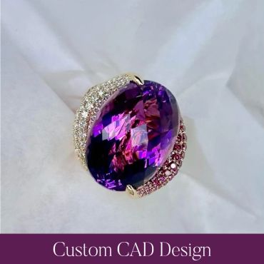 Top view of the finished custom ring featuring a large oval purple gemstone and pink and white accen