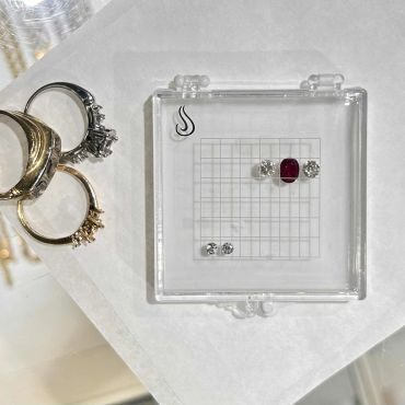 Original rings and loose gemstones used to create a new custom ring.