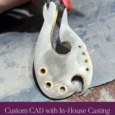 Two-tone fishhook pendant during fabrication.