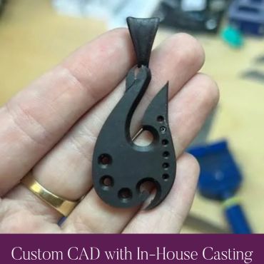 Black model of a custom fishhook pendant before casting.
