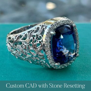 Side view of the finished blue gemstone ring with detailed metalwork.