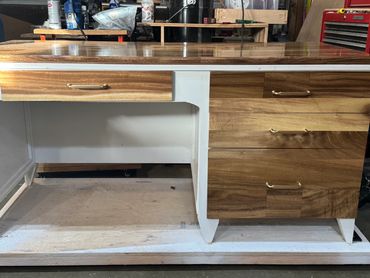 Custom-built wooden table with woods and Micah