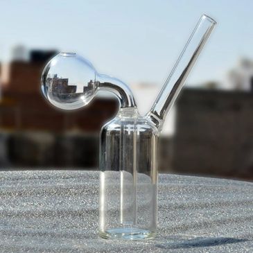 A clear glass water pipe with a spherical chamber and angled mouthpiece.