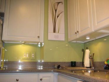 green back painted glass for kitchen backsplash