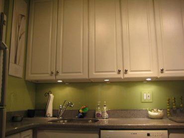 green back painted glass for kitchen backsplash