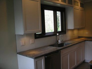 green back painted glass for kitchen backsplash